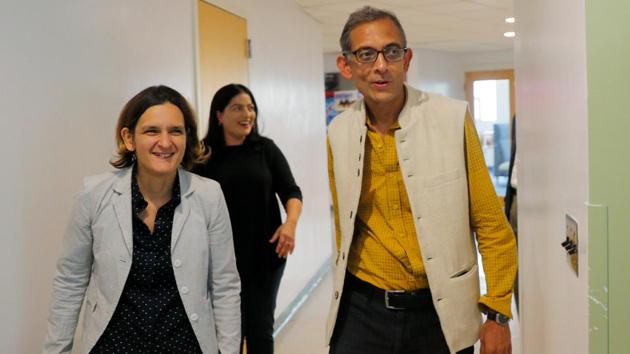 Abhijit Banerjee and Esther Duflo, two of the three winners of the 2019 Nobel Prize in Economics, arrive for a news conference at the Massachusetts Institute of Technology (MIT) in Cambridge, Massachusetts, U.S.(REUTERS)