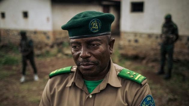 De-Dieu Bya’Ombe Balongelwa, Chief of Kahuzi-Biega National Park, stands at courtyard of the park headquarters. “There were armed men on the farms. These were purely military operations,” Balongelwa said. “The farmers vowed to use every means to undermine us. Using the Pygmies to come and destroy the park is one of them,” said the director, who is given round-the-clock protection by two armed rangers. “I’ve done what others didn’t dare do.” (Alexis Huguet / AFP)