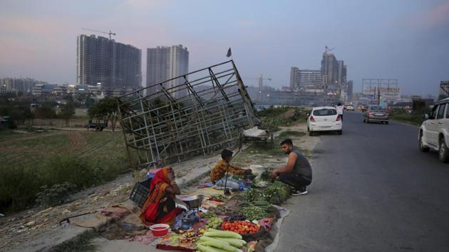 A roadside vegetable seller waits for customers in Noida on the outskirts of New Delhi, India. The International Monetary Fund (IMF) on Tuesday in its World Economic Outlook (WEO) report slashed India’s growth projection for the year 2019 to 6.1 per cent (Photo: AP) A roadside vegetable seller waits for customers in Noida on the outskirts of New Delhi, India. The International Monetary Fund (IMF) on Tuesday in its World Economic Outlook (WEO) report slashed India’s growth projection for the year 2019 to 6.1 per cent (Photo: AP)