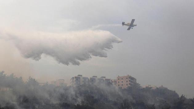 Fire crews were overwhelmed by the flames, forcing the Interior Ministry to send riot police with engines equipped with water cannons to help. Two small aircraft were sent from the nearby Mediterranean island of Cyprus to help put out the flames. The state has been widely criticized by residents because Lebanon bought three aircraft years ago to be used in extinguishing fires but they are parked at Beirut’s airport with no money to maintain them. (Aziz Taher / REUTERS)