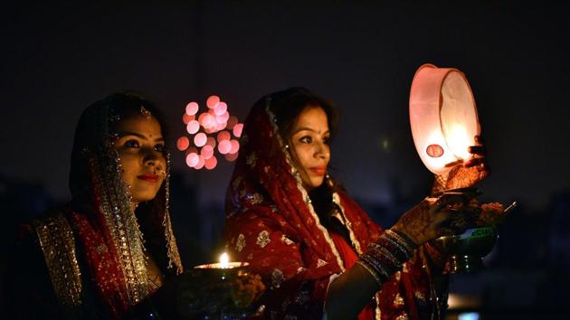 Moon viewing through the sieve is an important ritual of Karwa Chauth.