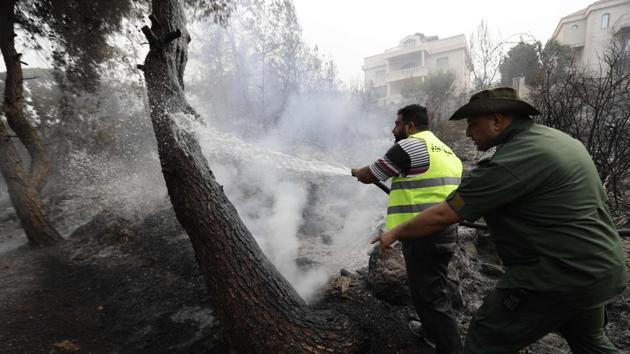 A heat wave in the region coupled with strong winds intensified the fires that began a day earlier in mostly pine forests around the country and three provinces in neighbouring Syria. (Joseph Eid / AFP)