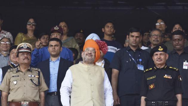 Home Minister Amit Shah with NSG Director General S.S.Deswal (R) and Director General CRPF Rajeev Rai Bhatnagar (L) during the 35th NSG Raising Day. Shah lauded the NSG while recalling its role in the aftermath of the 2002 Akshardham temple attack in Gujarat and the 26/11 attacks in Mumbai in 2008. “This inspires confidence in the minds of the citizens that they are in safe hands,” he said. (Sanjeev Verma/HT Photo)
