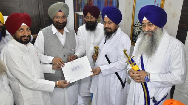 Two state cabinet ministers — Sukhjinder Singh Randhawa (jails and cooperation) and Charanjit Singh Channi (technical educational & industrial training) who are representing the government in the coordination committee formed by the Akal Takht for the joint event — on Tuesday morning met acting Akal Takht jathedar Giani Harpreet Singh and handed him over a letter of Punjab chief minister Amarinder Singh in a sealed envelope.(Sameer Sehgal/HT)