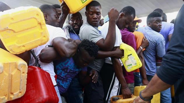 People fight as they line up at a closed gas station, hoping it will open eventually. Much of the anger stems from an investigation released by Haiti’s Senate that accuses former top government officials of misusing some $2 billion in funds tied to a Venezuelan subsidized oil program that were slated for social programs. The report also mentioned a company once owned by Moïse. (Dieu Nalio Chery / AP)