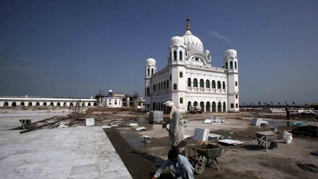 Laborers work at the sites of the Gurdwara Darbar Sahib, which will be open this year for Sikh pilgrims, in Kartarpur, Pakistan. (REUTERS) Laborers work at the sites of the Gurdwara Darbar Sahib, which will be open this year for Sikh pilgrims, in Kartarpur, Pakistan. (REUTERS)