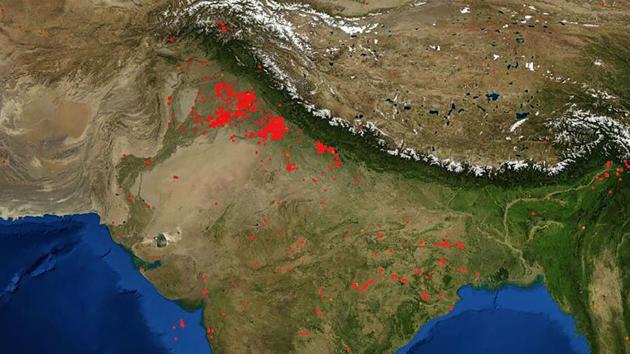 Red dots indicate stubble burning in areas surrounding Delhi in this image released on October 15. NASA scientists reported fewer cases of farm fires in the region from September 25, when harvesting began in these states. Experts blame this dip in the capital’s air quality mainly on local factors such as construction and road dust, and garbage burning that need to be reined in urgently. (NASA FIRMS / PTI)