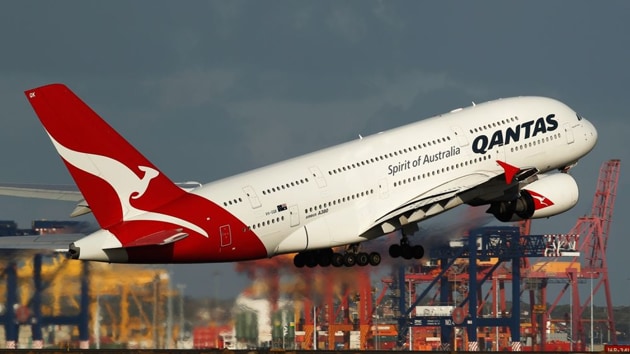 Rather than following the standard practice of serving food and dimming the lights after takeoff, Qantas plans to keep everyone awake for six hours.(Bloomberg image)