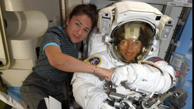 Christina Koch (L) and Jessica Meir pose for a photo at the International Space Station on October 04. Koch, an electrical engineer, already has done three spacewalks; she’s seven months into an 11-month spaceflight that will be the longest by a woman. (NASA / AP)