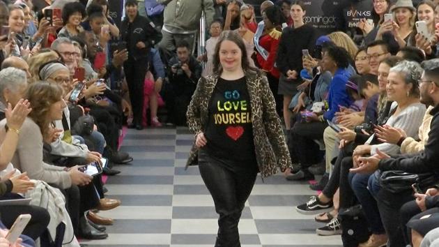 This image from video taken on Wednesday, Oct. 16, 2019 shows a girl participating in the 2nd annual “Gigi’s Playhouse Fashion Show” in New York. Gigi’s Playhouse is an education and achievement center that prepares young people with Down syndrome to engage more fully in their homes, schools and communities. (AP Photo/Gary Gerard Hamilton)(AP)
