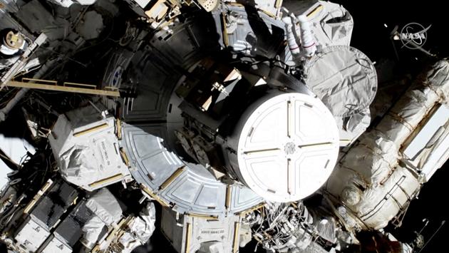 Koch and Meir step out of the International Space Station (ISS) to attempt the first all-female spacewalk. All four men aboard the ISS remained inside, as Koch and Meir went out to replace the broken battery charger. (NASA / REUTERS)