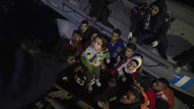 Dinghies carrying migrants from Syria, Afghanistan, Iraq and elsewhere are reaching the islands despite enhanced coast guard patrolling in recent weeks supported by the Greek military. This is exacerbating problems at crowded refugee camps. A deadly fire at the Moria refugee camp on Lesbos on September 29 triggered riots at the site, which is at 400% capacity. (Petros Giannakouris / AP)