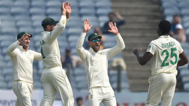 The South African team celebrates Rohit Sharma’s wicket.(Pratham Gokhale/HT Photo)