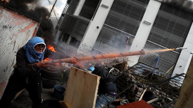 A demonstrator fires a homemade weapon during a protest against Ecuador’s President Lenin Moreno’s austerity measures in Quito, Ecuador. (Ivan Alvarado / REUTERS)