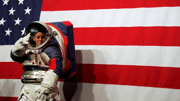 Advanced Space Suit Engineer at NASA Kristine Davis wears the xEMU prototype space suit for the next astronaut to the moon by 2024, during its presentation at NASA headquarters in Washington. (Carlos Jasso / REUTERS)