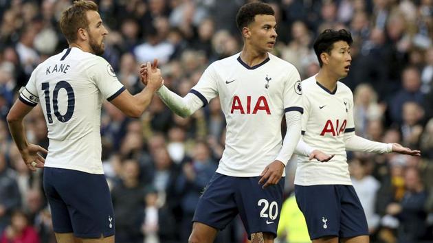 Tottenham Hotspur's Dele Alli, centre, celebrates with team-mates Harry Kane, left, and Son Heung-min.(AP)