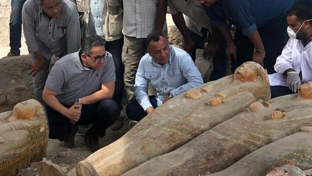 Officials looking at recently discovered ancient colored coffins with inscriptions and paintings, in the southern city of Luxor, Egypt. (AP photo) Officials looking at recently discovered ancient colored coffins with inscriptions and paintings, in the southern city of Luxor, Egypt. (AP photo)