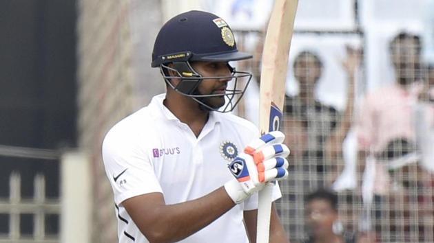 Indian cricketer Rohit Sharma raises his bat. (PTI) Indian cricketer Rohit Sharma raises his bat. (PTI)
