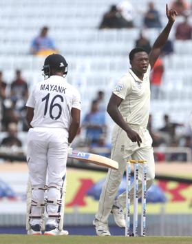 South Africa's Kagiso Rabada, right, celebrates the dismissal of India's Mayank Agarwal, left, during the third and last cricket test match between India and South Africa in Ranchi. (AP)