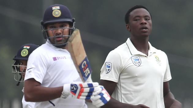 South Africa's Kagiso Rabada, right, reacts as India's Rohit Sharma run between the wickets. (AP)