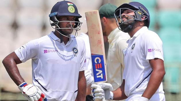 India's Rohit Sharma, right, celebrates after scoring fifty runs with Mayank Agarwal.(AP)