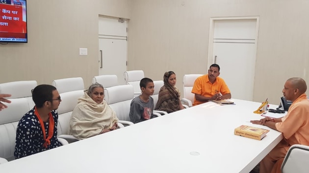 Family members of Kamlesh Tiwari meeting Uttar Pradesh Chief Minister Yogi Adityanath at his residence in Lucknow on Sunday.(HT PHOTO)