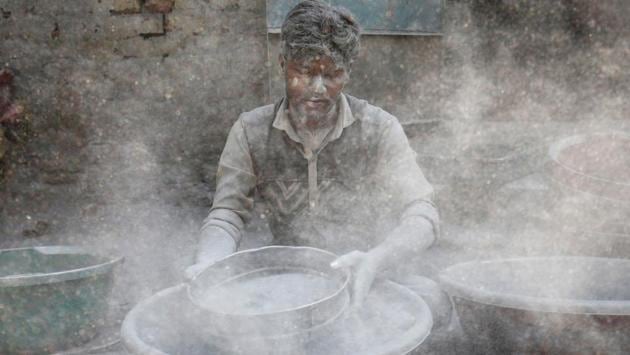 A worker prepares gunpowder to make firecrackers at a factory ahead of Diwali, at the outskirts of Ahmedabad, Gujarat. (Amit Dave / REUTERS)
