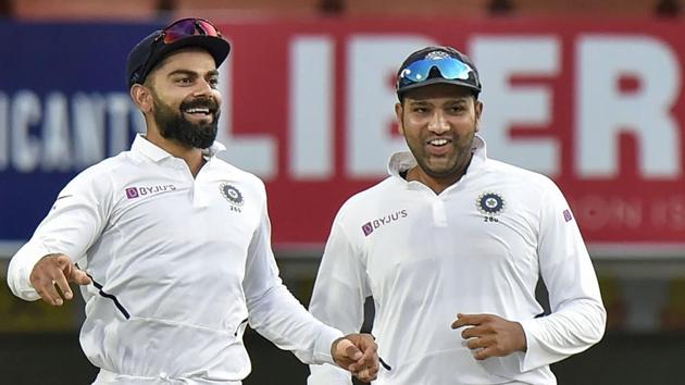 Indian captain Virat Kohli with teammate Rohit Sharma celebrates the dismissal of South Africa's Quinton de Kock. (PTI)