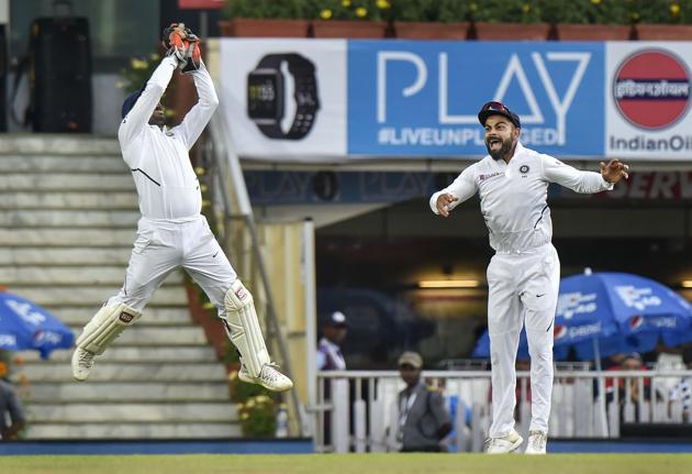 Indian captain Virat Kohli reacts as Wriddhiman Saha attempts a catch. (PTI)