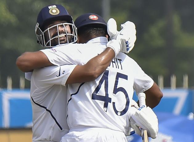 Ranchi: India's Ajinkya Rahane celebrates his century with partner Rohit Sharma during day 2 of the 3rd cricket Test. (PTI)