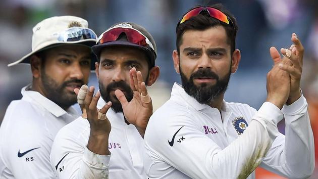 Indian cricket team captain Virat Kohli with teammates Ajinkya Rahane and Rohit Sharma.(PTI)