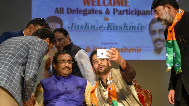 A supporter takes selfies with BJP National General Secretary Ram Madhav at the party's "Jashn-e-Kashmir" function, in Srinagar, Sunday, Oct. 20, 2019.(PTI) A supporter takes selfies with BJP National General Secretary Ram Madhav at the party's "Jashn-e-Kashmir" function, in Srinagar, Sunday, Oct. 20, 2019.(PTI)