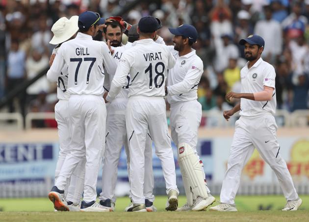 India's Mohammed Shami, center without cap, celebrates with teammates. (AP)