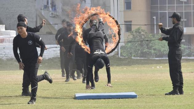 National Security Guard (NSG) Commandos perform a drill during the 35th NSG Raising Day at NSG Manesar campus, in Gurugram, Haryana. The NSG popularly known as the Black Cats, was raised in 1984 for combating terrorist activities and internal disturbances. It also handles VIP security. (Sanjeev Verma/HT Photo)