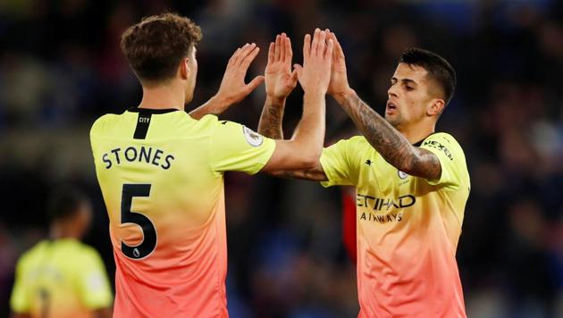 Manchester City's John Stones and Joao Cancelo at the end of the match(Action Images via Reuters)