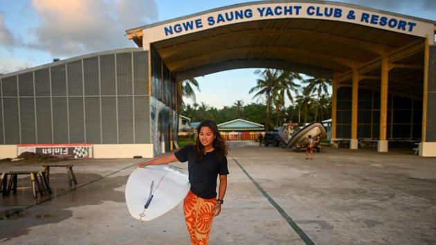 Myanmar’s Nida Soe carries her surfboard for a surfing practice session on Ngwe Saung beach in Irrawaddy division, ahead of the upcoming Southeast Asian (SEA) Games in the Philippines. Competitive surfing was barely known in Myanmar a few years ago but one local beach town is riding a wave of enthusiasm to the Southeast Asia Games for the first time ever. (Ye Aung Thu / AFP)