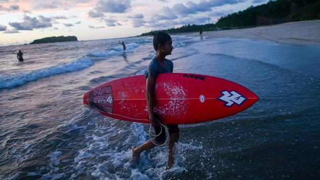 Ngwe Saung is the heartland of the growing craze and has now hosted several competitions.”We hadn’t heard of surfing before 2017,” said Aung Min Naing, 19. But he is “so excited” to represent Myanmar at the upcoming games.”It will be a difficult competition but we will do our best for sure.” (Ye Aung Thu / AFP)