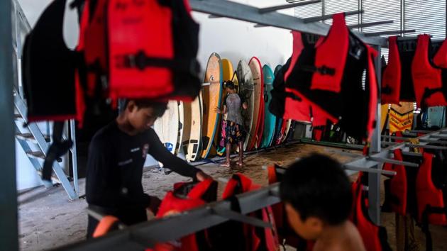 The Surf Association of Myanmar was established only this year. The sport is slowly gaining prominence thanks to the impassioned surfers, most from a village near the beach and newcomers themselves. (Ye Aung Thu / AFP)