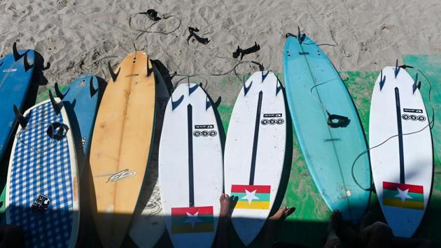 The mild waves at Ngwe Saung present a paradox for competitive surfers -- they are good to learn on but much tamer than the conditions in surfing hotspots. The team went to Bali in Indonesia for two months to get used to some “big wave surfing” and have made enormous strides in a short amount of time. (Ye Aung Thu / AFP)