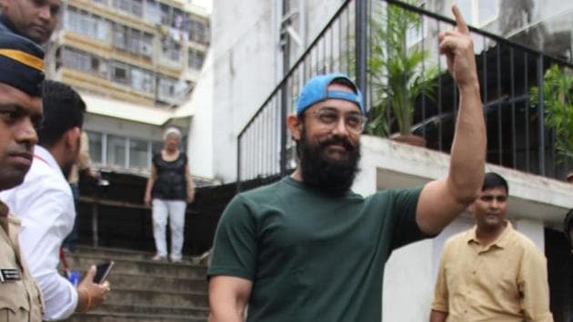 Aamir Khan shows his inked finger to the paparazzi.