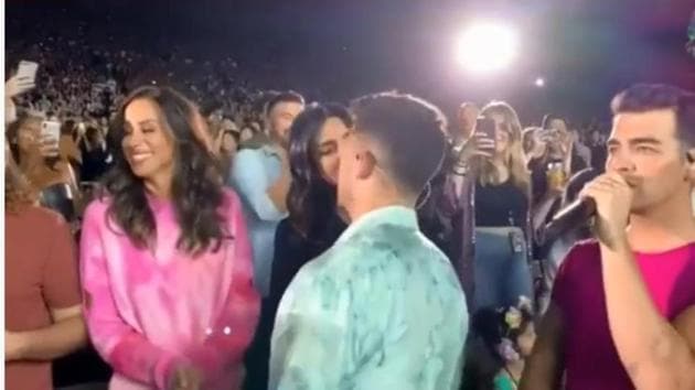 Priyanka Chopra kisses Nick Jonas during the concert.