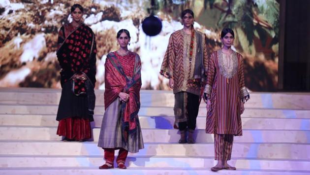 Besides Ajrak, Sindhu showcased the richness of crafts from across the country - traditional Mashru from Bhuj along with lighter, cotton silk stripes in bright jewel tones handwoven in Benaras, Bandhini tie-and-dye with highlights of the painstaking rai-dana variety from Bhuj, and the folk Chaand (crescent Moon) motif from Bikaner, Punjabi Phulkari, Sindhi taanka (embroidery), Rabari mirrorwork, folk beading, varq, leheriya and hand-block prints.  (Rajesh Kashyap / HT Photo) 