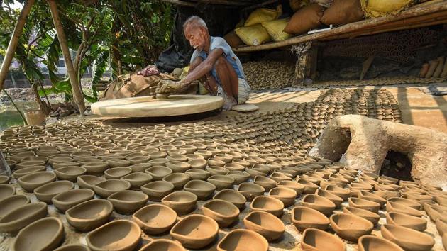 A potter makes traditional 'Diyas' (earth lamps) ahead of Diwali festival (representational image)(PTI)