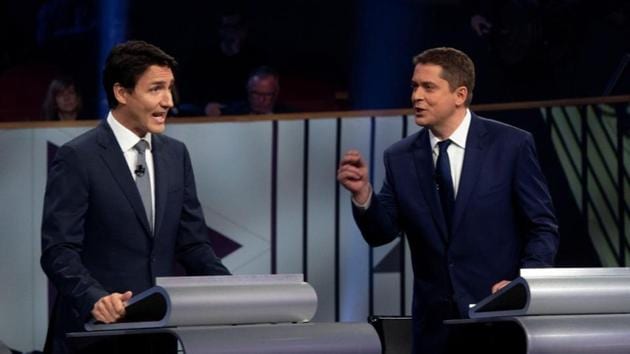 Liberal leader Justin Trudeau and Conservative leader Andrew Scheer take part in the Federal leaders French language debate in Gatineau, Quebec, Canada. (Reuters photo) Liberal leader Justin Trudeau and Conservative leader Andrew Scheer take part in the Federal leaders French language debate in Gatineau, Quebec, Canada. (Reuters photo)