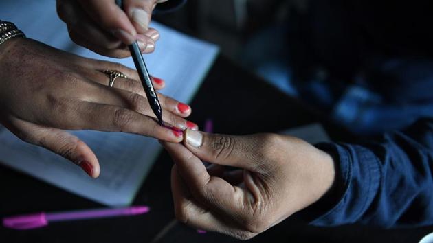 A woman has her finger inked after voting at a polling station in Ganaur, Haryana. Voters in the state said they were voting for issues related to employment. “We want someone who is educated to rule our state and fix our problems,” said Mohamad Sajid, a voter in Mewat district. The votes in Haryana and Maharashtra will be counted on October 24. (Prakash Singh / AFP)