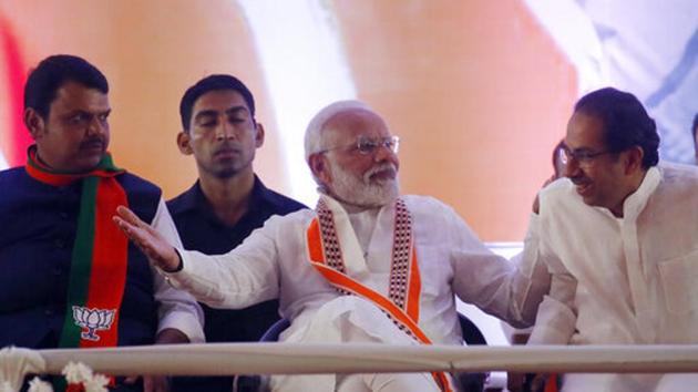 Prime Minister of India Narendra Modi, center, talks with Chief Minister of Maharashtra Devendra Fadnavis, left and Shivsena Chief Uddhav Thackeray during an election campaign rally in Mumbai. (Photo: AP) Prime Minister of India Narendra Modi, center, talks with Chief Minister of Maharashtra Devendra Fadnavis, left and Shivsena Chief Uddhav Thackeray during an election campaign rally in Mumbai. (Photo: AP)