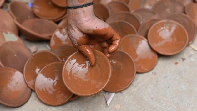 “Many potters here are also a part of the problem; they are reluctant to learn new techniques, and improve the quality of their wares to make them more competitive in the market. They first need to treat themselves as artisans and not manual labourers. Our colony has many talented potters,” said Harkishan, who has travelled to countries such as Germany, Spain and Japan on government-sponsored tours. (Vipin Kumar / HT Photo) 