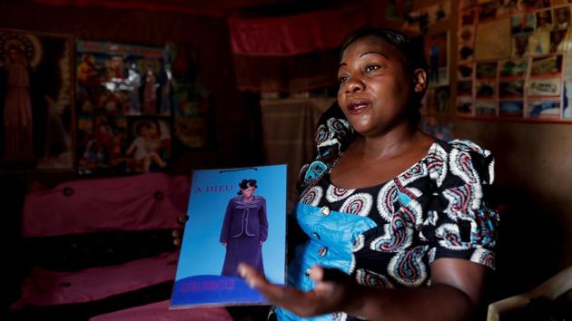To this day, Kavugho has not been able to find the graves of her 19-year-old daughter and two-month-old granddaughter, who died of Ebola while she was receiving treatment and were hastily buried to avoid contamination. “I try to find the dates on the crosses that may coincide with their deaths but I always come back empty-handed,” she said softly, clinging to a picture of her daughter with the word “adieu” written alongside. (Zohra Bensemra / REUTERS)