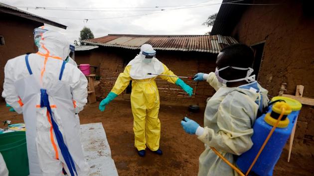 Kavota Mugisha Robert (R), a healthcare worker, decontaminates his colleague after he entered the house of 85-year-old woman, suspected of dying of Ebola, in Beni. The survivors, who call themselves “les vainqueurs” - French for “the victorious” - struggle to return to their former lives as they deal with the fear of relapse, long-term health issues like blurry vision and headaches and stigmatisation by their families and neighbours. (Zohra Bensemra / REUTERS)