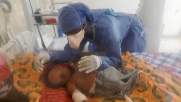 Vianey Kombi, 31, takes care of a three-month-old orphan girl confirmed to be suffering from Ebola in Beni. Kombi was a maths teacher when he contracted Ebola last November. Like Kavugho, he found it impossible to return to his former job. “It hurts when I walk past the school where I was teaching, and the children who recognise me start screaming in my direction: Ebola, Ebola,” he said. (Zohra Bensemra / REUTERS)